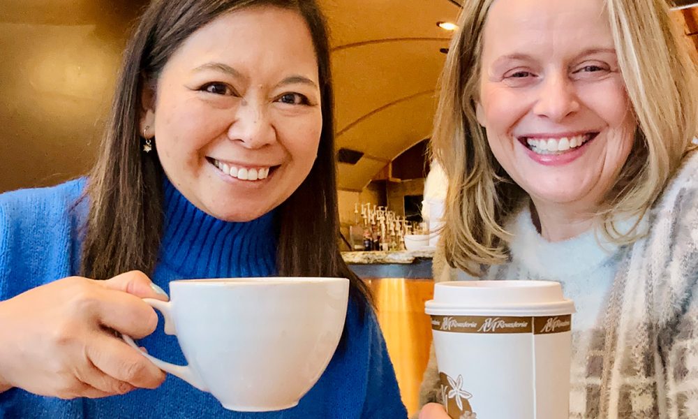 Marlynn Jayme Schotland and Barbara Kleinke holding coffee cups.