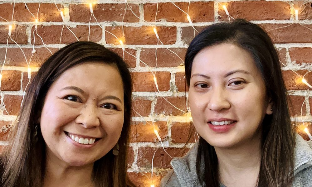 Marlynn Jayme Schotland and Waz Wu holding coffee cups.